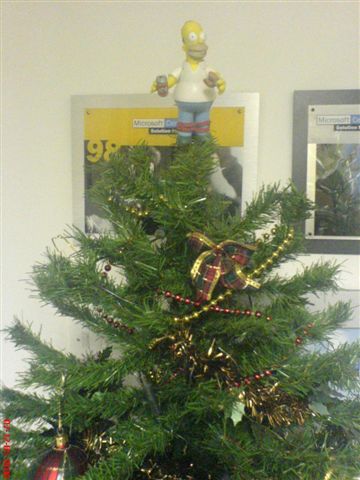 Homer on top if the Christmas Tree